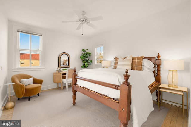 bedroom featuring ceiling fan and hardwood / wood-style floors