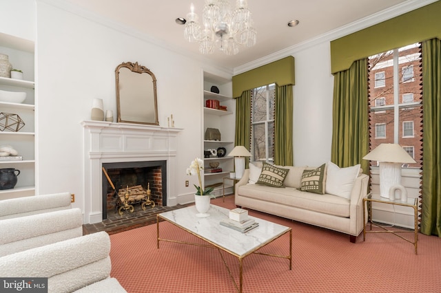 living room with ornamental molding, a chandelier, and built in features