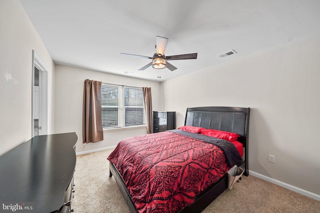 bedroom with ceiling fan and light colored carpet