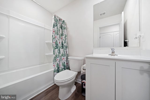 full bathroom with toilet, shower / bathtub combination with curtain, hardwood / wood-style floors, and vanity