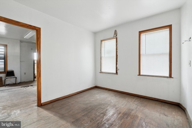 spare room with hardwood / wood-style flooring