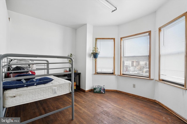 bedroom featuring dark wood-type flooring