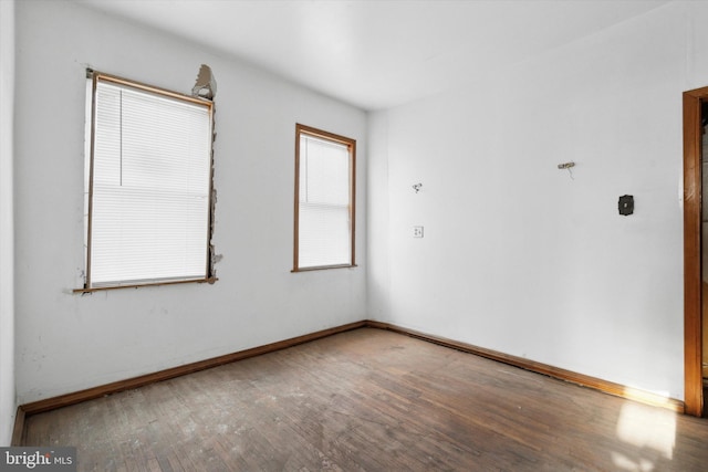 spare room with hardwood / wood-style flooring