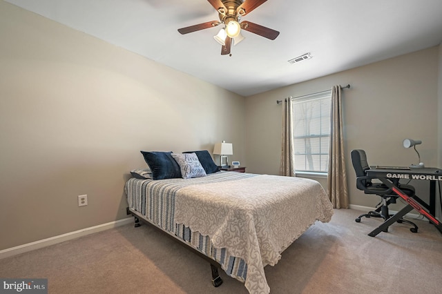 bedroom with light colored carpet and ceiling fan