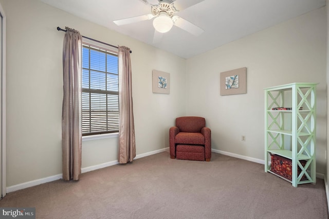 unfurnished room featuring light colored carpet and ceiling fan