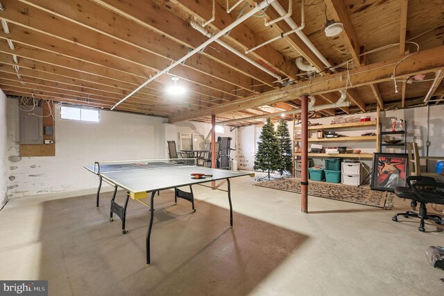 rec room featuring concrete floors