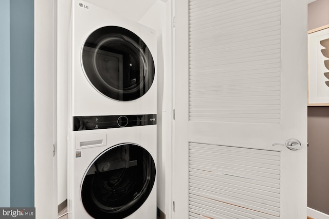 washroom with stacked washer and clothes dryer