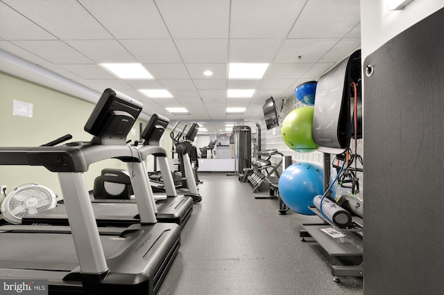 gym featuring a paneled ceiling