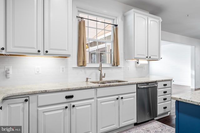 kitchen featuring dishwasher, white cabinetry, sink, dark wood-type flooring, and light stone counters