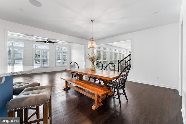 dining room featuring ceiling fan and dark hardwood / wood-style flooring