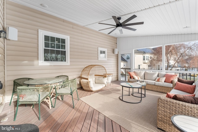 wooden deck featuring ceiling fan and outdoor lounge area