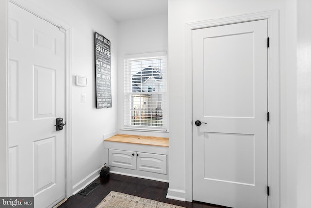 interior space with dark hardwood / wood-style flooring