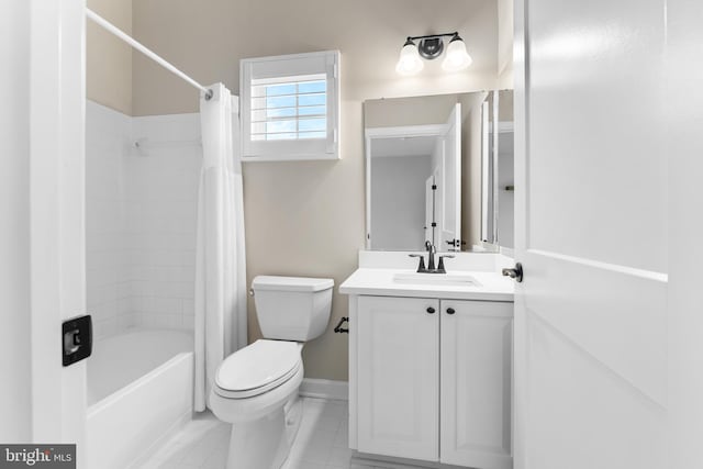 full bathroom featuring vanity, toilet, shower / bath combo with shower curtain, and tile patterned flooring