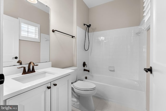 full bathroom with vanity, toilet, and  shower combination