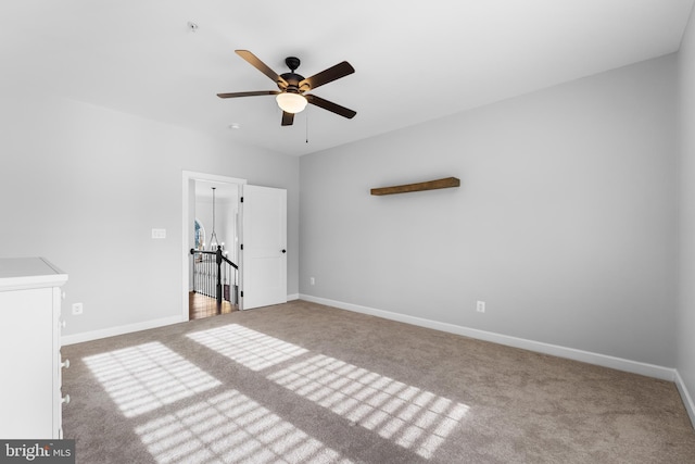 unfurnished bedroom featuring ceiling fan and carpet floors