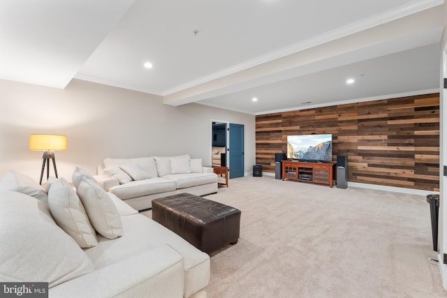 carpeted living room featuring crown molding and wooden walls