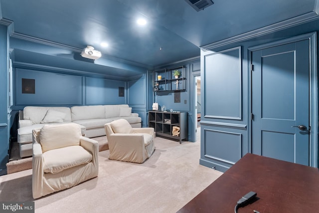 carpeted cinema room with crown molding