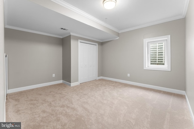 basement with light carpet and crown molding