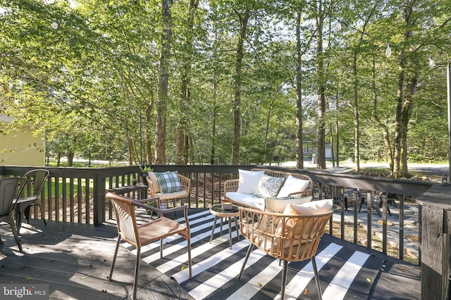 wooden terrace featuring outdoor lounge area