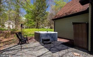 view of patio / terrace featuring a hot tub