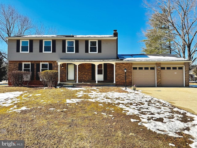 front facade featuring a garage and covered porch