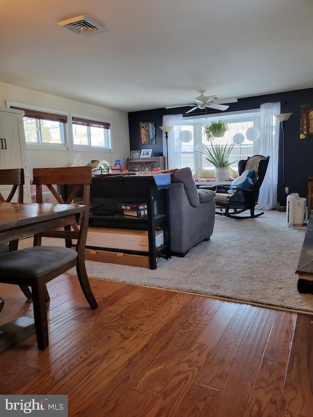 dining room with ceiling fan and wood-type flooring