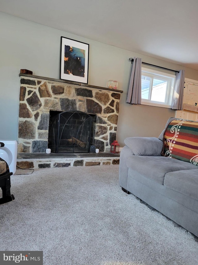 carpeted living room featuring a fireplace