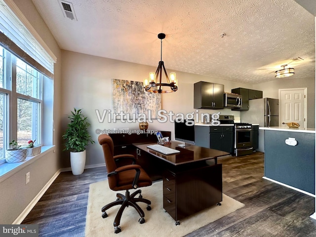 home office featuring dark hardwood / wood-style floors, a chandelier, and a textured ceiling