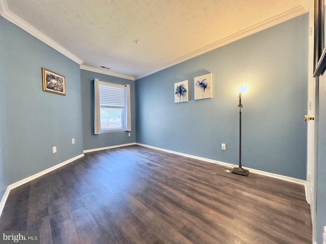 spare room with crown molding, dark hardwood / wood-style flooring, and a textured ceiling