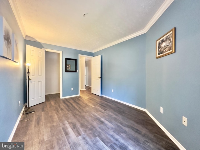 unfurnished bedroom featuring dark wood-type flooring and crown molding