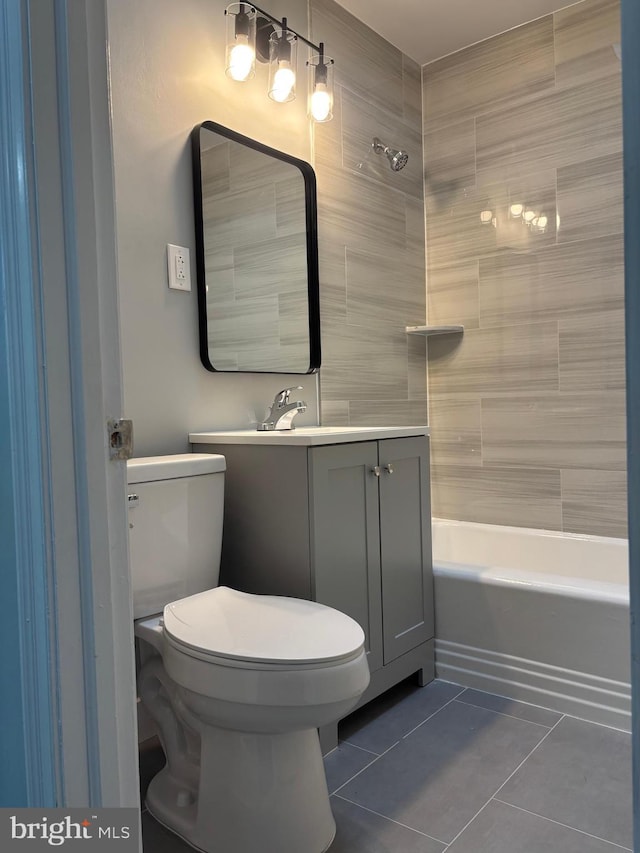 full bathroom with toilet, tile patterned floors, vanity, and shower / bathing tub combination