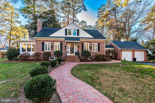 view of front of property with a garage and a front yard