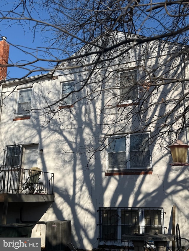 view of home's exterior with a balcony