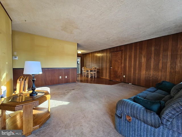 carpeted living room with a textured ceiling