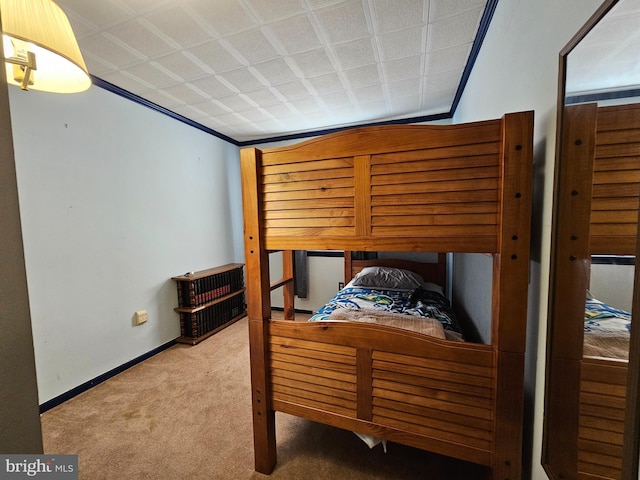 carpeted bedroom featuring ornamental molding