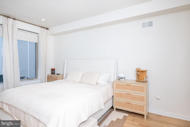 bedroom with wood-type flooring