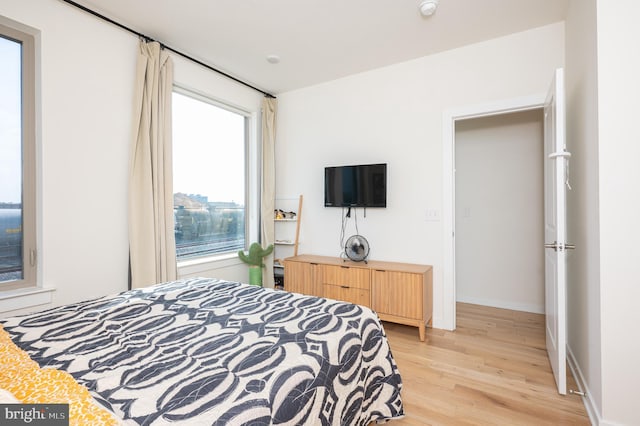 bedroom with light wood-type flooring