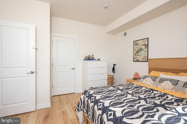 bedroom with light hardwood / wood-style floors