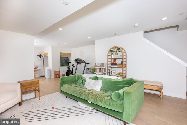 living room with light hardwood / wood-style flooring