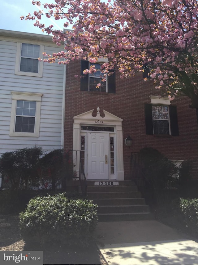 view of front of property with brick siding