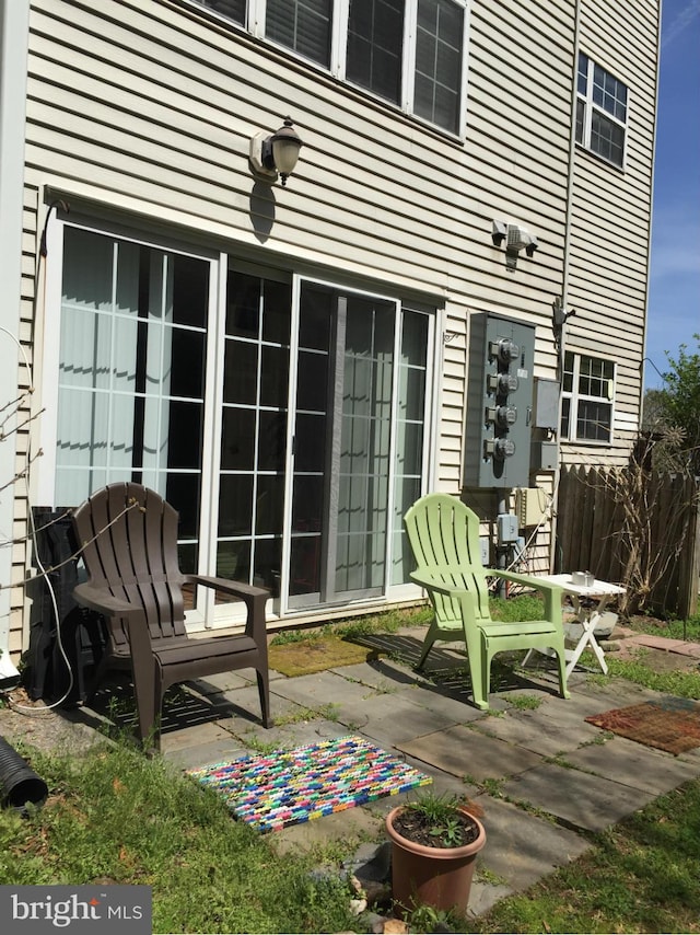 view of patio featuring fence