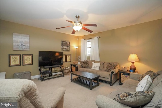 living room featuring ceiling fan and light colored carpet