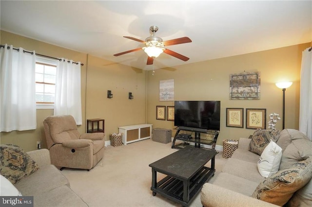 living room featuring ceiling fan and light colored carpet