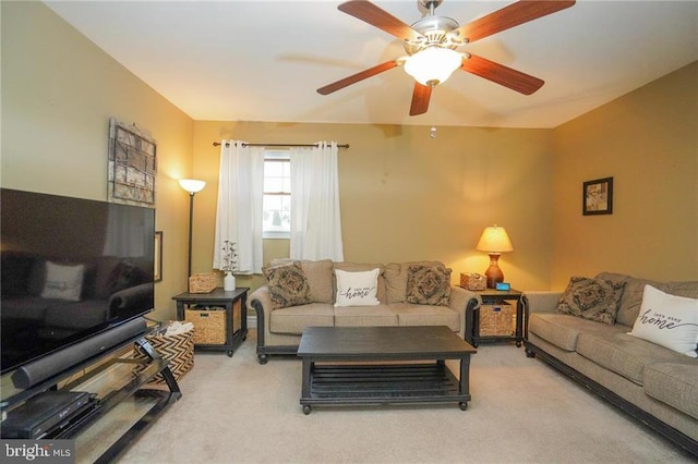 living room featuring ceiling fan and carpet flooring