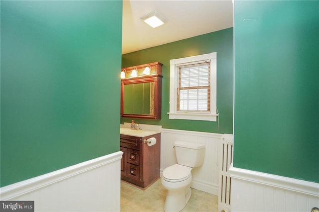 bathroom with toilet and vanity