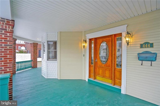 doorway to property with a porch