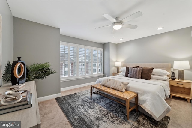 carpeted bedroom featuring ceiling fan