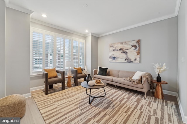 living room with ornamental molding and hardwood / wood-style flooring