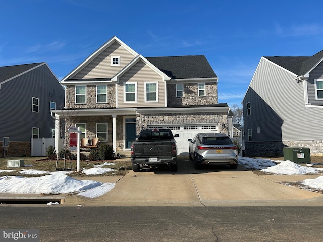 view of front facade with a garage and covered porch