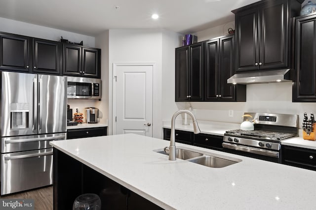 kitchen with light stone counters, stainless steel appliances, dark wood-type flooring, and sink